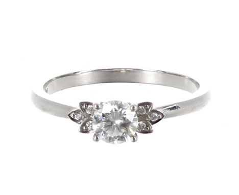 GIA certified platinum diamond ring, round brilliant-cut centre diamond, 0.63ct, clarity SI2, colour I, diamond set shoulders