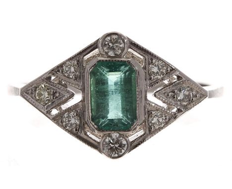 Ornate Art Deco style emerald and diamond dress ring, the emerald 0.60ct approx, in a pierced stylised diamond setting, 0.20c