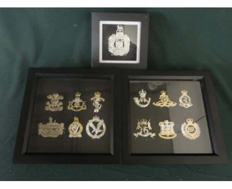 Three small framed and mounted displays of British military cap badges, various regiments including Lancers, Artillery, Light
