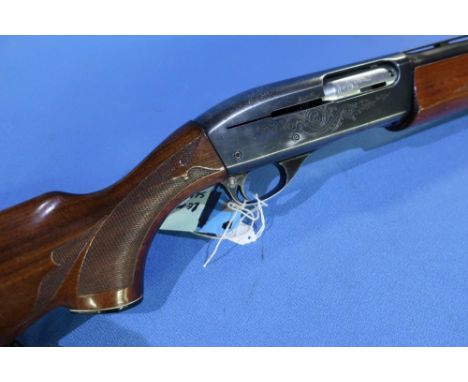 Remington model 1100 12 bore semi auto shotgun with 25 inch barrels, 13 3/4 inch pistol grip stock (no cocking handle), seria