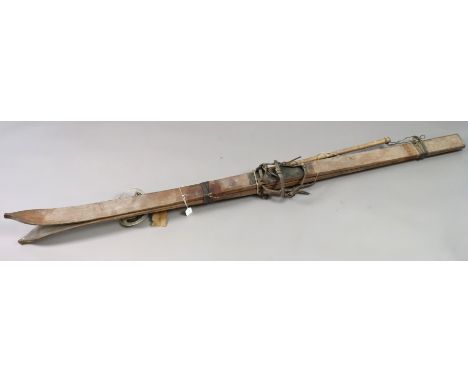 A pair of vintage “Tourist” skis; &amp; a pair of bamboo ski poles. 