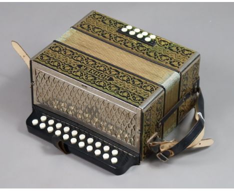 Another Hohner piano accordion in a blue &amp; gold polished case with all-over repeating foliate design. 