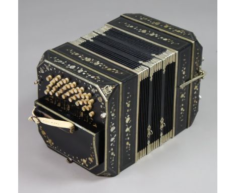 A vintage Premier Bandoneon accordion in a black polished case with all-over mother-of-pearl inlaid floral decoration, &amp; 