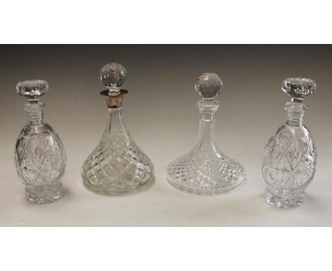 A cut glass ship's decanter, silver collar, Birmingham 1988; a Waterford crystal cut glass ship's decanter and stopper; a pai
