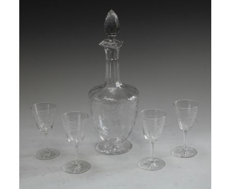 A clear glass liqueur decanter finely engraved with fanciful birds perched amongst foliage, faceted stopper, star cut base, 3