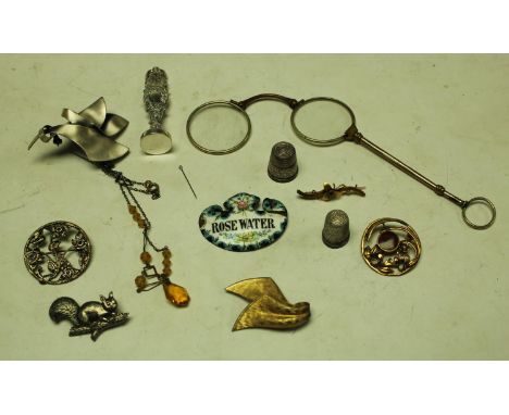 An 19th century enamelled decanter label, Rose water;  a pair of gilt metal lorgnettes;  15ct gold flower brooch;  others;  e
