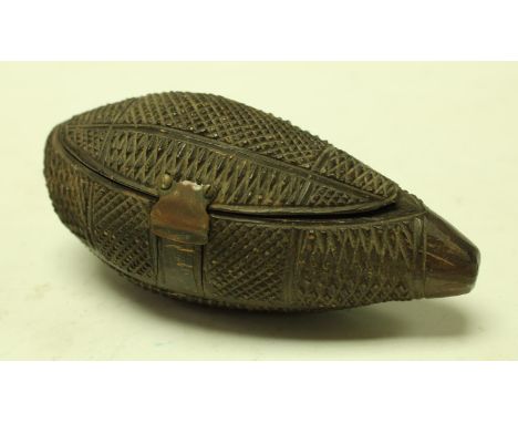Tribal Art - an unusual snuff box carved from a tear shaped nut probably c.1880, 11cm long