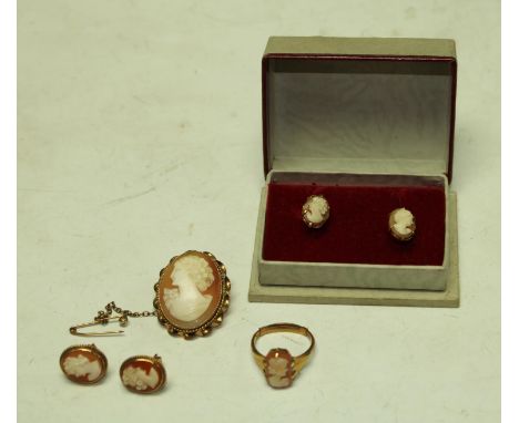A 9ct gold mounted carved Cameo brooch, marked 375; a similar 9ct gold ring and two pair of earings (6) 
