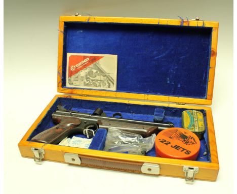 A Crossman model 1300 .22 calibre air pistol, with original box and manual