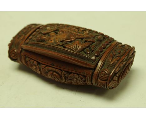 A 19th century French coquilla carved pillow shaped snuff box, 7cm wide, c1850