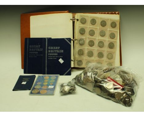 UK coins: a collector's album, ring-bound plastic covered with 16 lear plastic pocket pages, three unfilled, containing circu