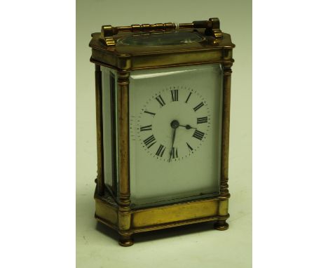 A 19th century carriage clock, shaped brass case