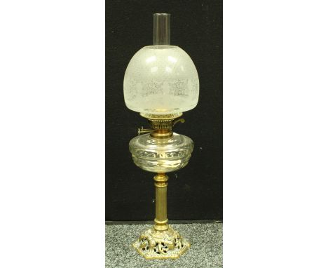 A Victorian brass column oil lamp, pierced domed brass base, clear glass reservoir, acid etched shade, Sherwood of Birmingham
