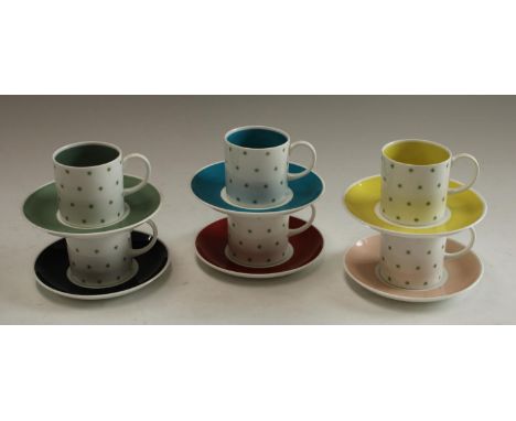 A Susie Cooper set of six harlequin coffee cans and saucers