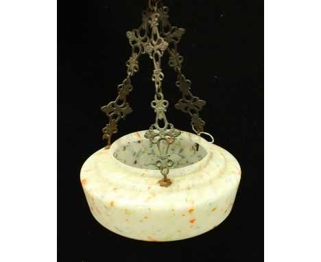 A ceiling light, with ornate brass hanger