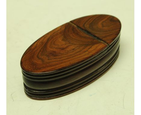 A George III oval treen snuff box with hinged lid 9cm long circa 1800