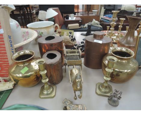 A selection of vintage brass and copper items including model horse and cart, copper caddy, candle sticks etc