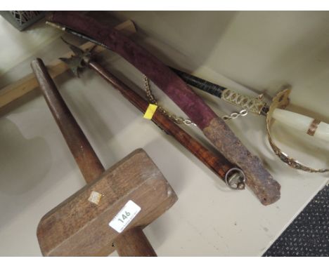 A selection of weaponry swords display axe etc