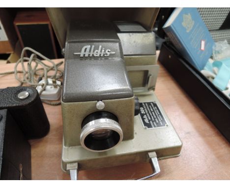 A vintage Aldis 505 slide projector with case