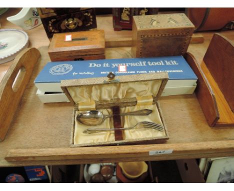 A treen tray containing boxes, rack, flatware and wallpapering tools