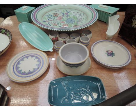 A selection of Poole pottery dishes, bowls, boxes and egg cups etc