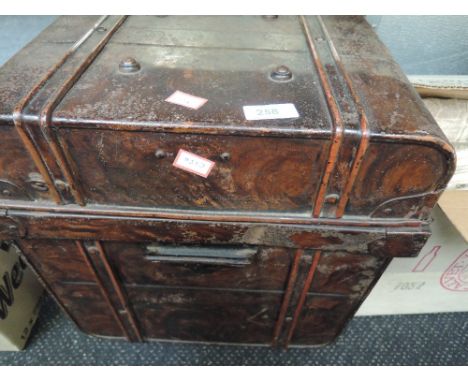 A vintage tin bedding or travel trunk with wood effect finnish