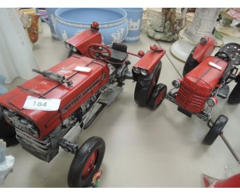 Two Massey Ferguson tractor models in classic red one vintage style