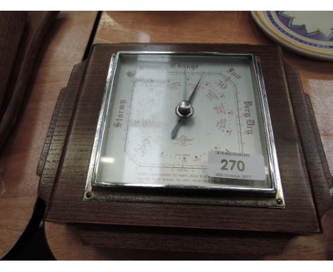 An oak framed mid 20th century barometer