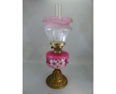 Victorian oil lamp with pink floral design, complete with shade and chimney