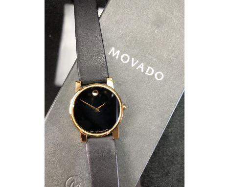 Movado wristwatch with black strap MODEL 87G40875 SERIAL 4272531 quartz movement in original box with paperwork