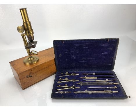 Vintage boxed microscope and a vintage compass set
