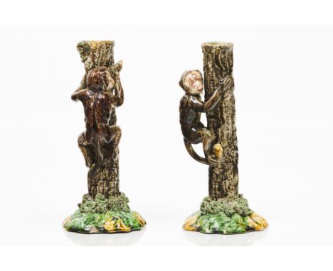 Par of candlesticksIn glazed and polychrome terracotta representing a tree trunk with monkeyPortugal, 20th centuryIllegible m