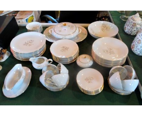 A mid-20th century Continental part-dinner service, having gilt floral decoration on an ivory ground with gilt finish, compri