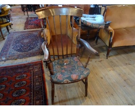 A 20th century stick back Windsor armchair (54cm wide).