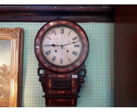 A mahogany and mother of pearl inlaid wall clock, the enamel dial bearing Roman numerals (67cm).