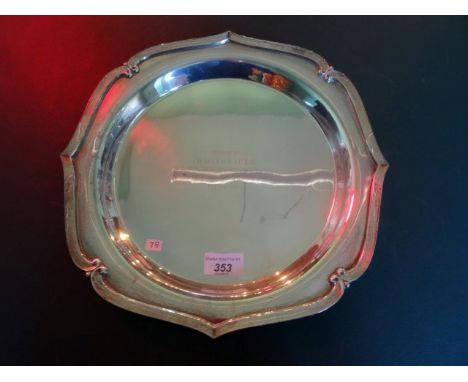 A sterling silver presentation salver with shaped border (33cm diameter).