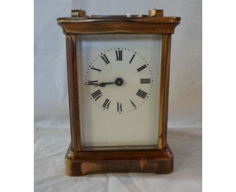 A French gilt brass carriage clock, having five bevel edged glass panels, the movement signed R & Co., Paris, the enamel dial