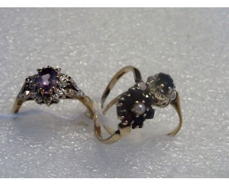 A garnet and pearl cluster ring, together with an amethyst cluster ring and a sapphire cluster ring.