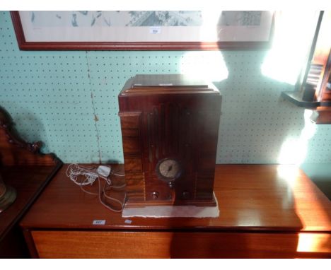 An early to mid 20th century Zenith mahogany and walnut cased radio, having integral speaker, in the Art Deco style (30cm x 4