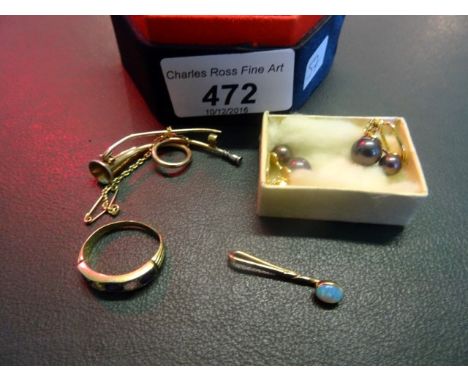 A yellow metal brooch modelled as a hunting horn, together with a pair of yellow metal earrings, a ring and an opal pendant.