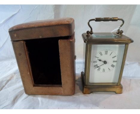 A French gilt brass carriage clock, single barrel movement, five panel bevel edged glass, the enamel dial bearing Roman numer