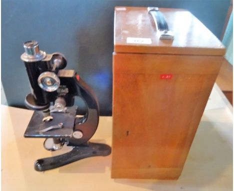A Beck London model 32320 microscope in fitted wooden case.