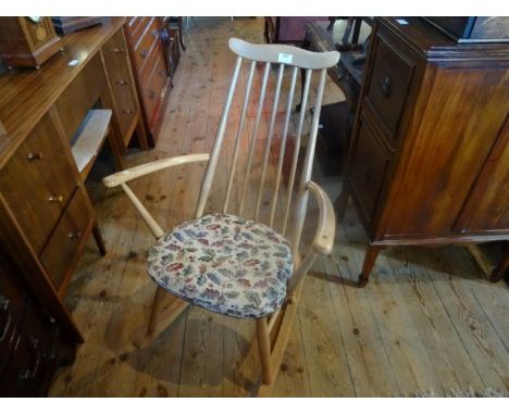 A contemporary stick back rocking chair (61cm wide).