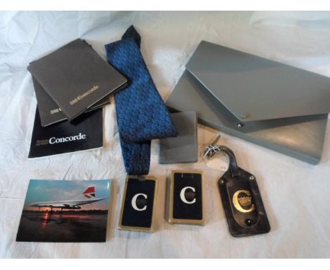 A mixed collection of British Airways Concorde memorabilia, to include: playing cards, a gentleman's tie, luggage tag, statio