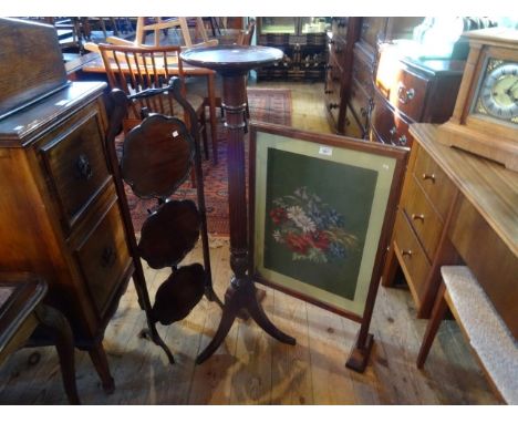 A Victorian three tier folding cake stand, together with a mahogany torchere and a fire screen with tapestry inlay.
