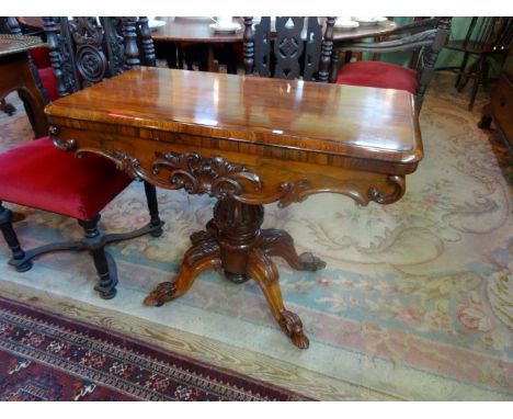 A Victorian rosewood fold-over card table on four out-swept supports (92cm wide). Condition Report: Age related wear and in n