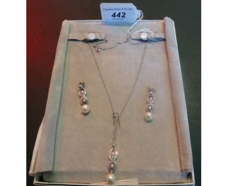 A pearl and diamond pendant with earrings en suite, single stone cultured pearl suspended from diamond set figure of eight mo