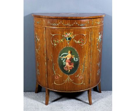 A late Victorian satinwood demilune cabinet, the top crossbanded in mahogany, the whole inlaid with bandings and stringings a