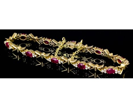 A modern 18ct gold mounted diamond and ruby set bracelet (approximate total ruby weight 2ct, and approximate total diamond we