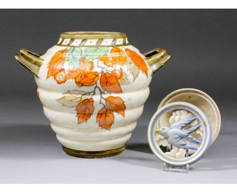 A Crown Ducal pottery two-handled vase decorated by Charlotte Rhead with "Autumn Leaves" design, 7ins diameter x 7.25ins high